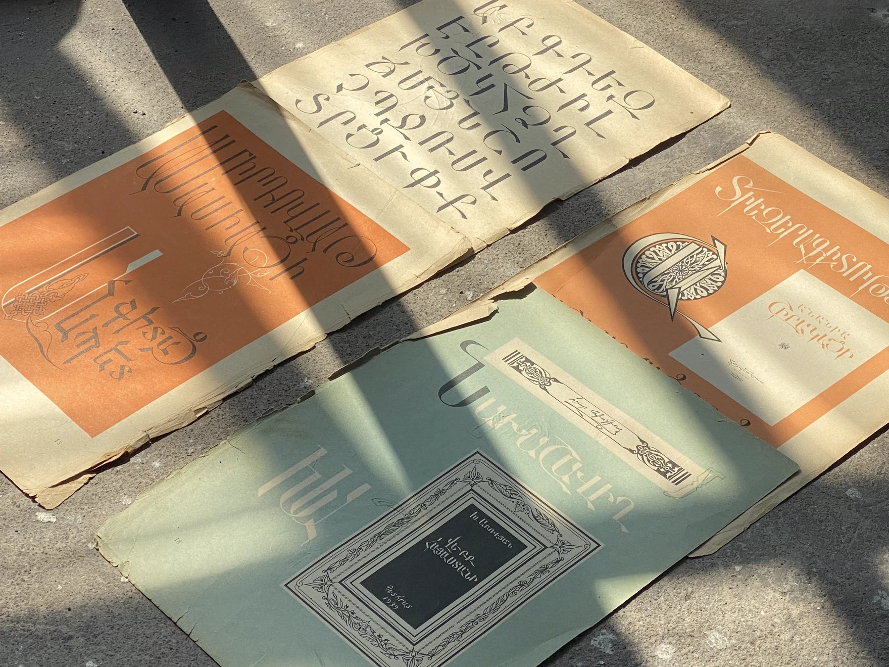 Armenian type specimens laid out on pavement